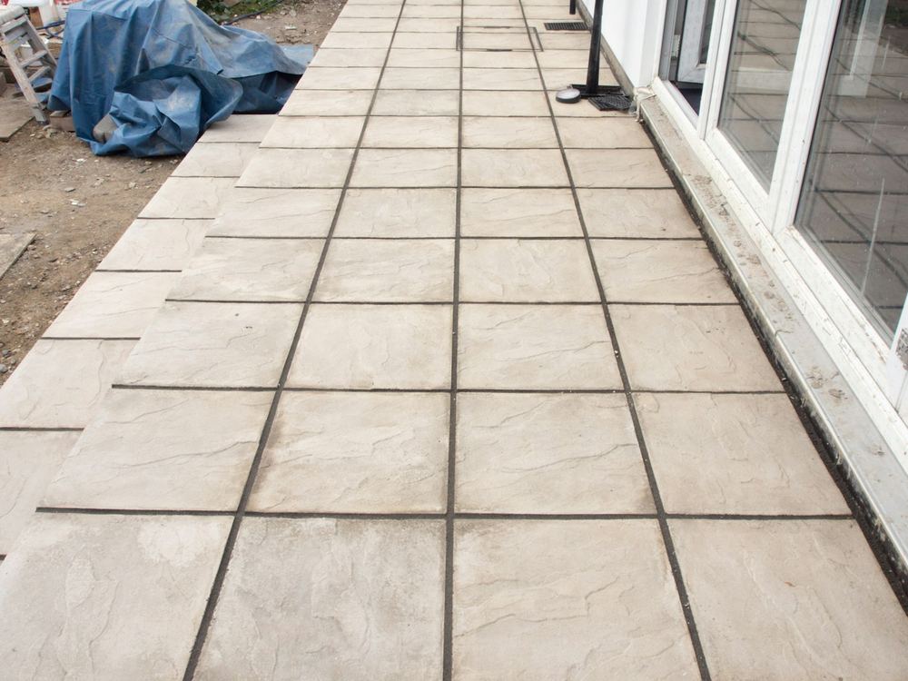 Concrete patio slab along a sliding door (illustrative photo)