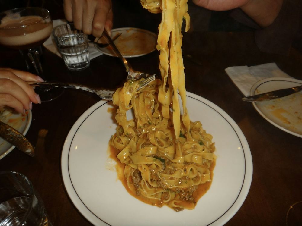Tagliatelle twirled on a fork (illustrative photo)