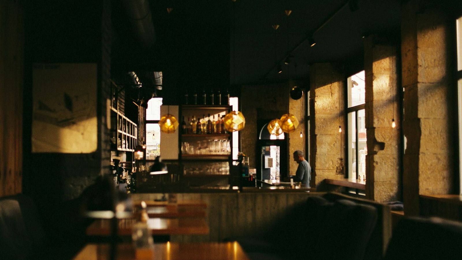 Warm, dimly lit dining room and bar (illustrative photo)