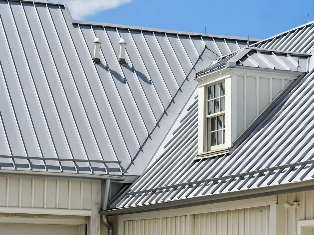 Standing seam metal roof with a dormer (illustrative photo)