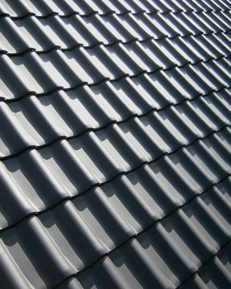 Close-up of dark metal roof panels (illustrative photo)