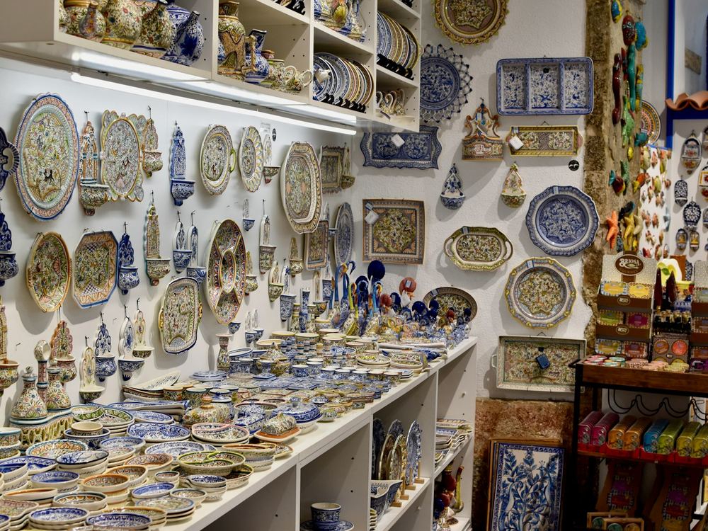 Shelves of hand-painted pottery and plates (illustrative photo)