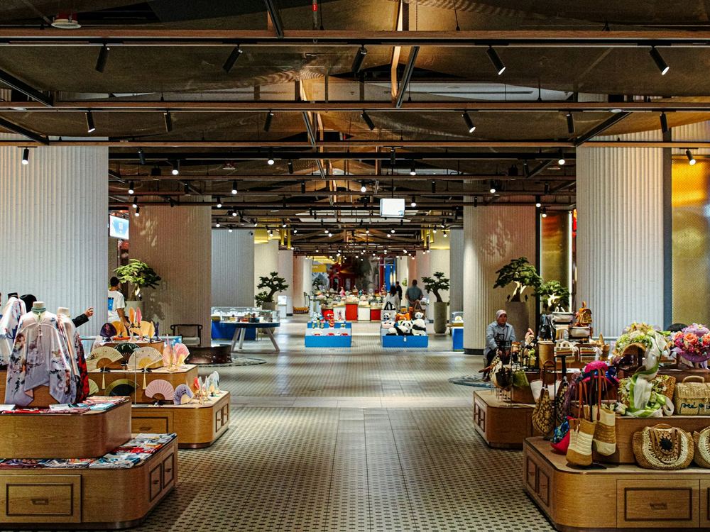 Spacious shop floor with wooden display tables (illustrative photo)