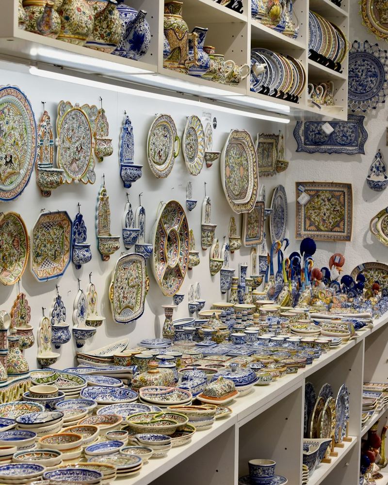 Close-up of painted pottery on shelves (illustrative photo)